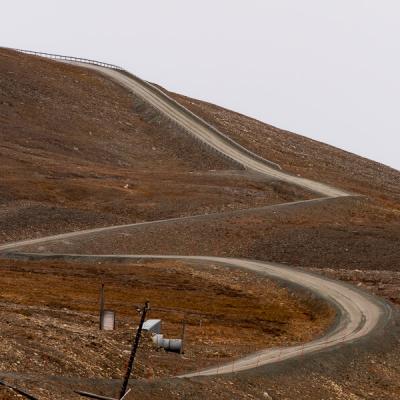 Svalbard Meandering Road Up The Mountain Grey Sky900