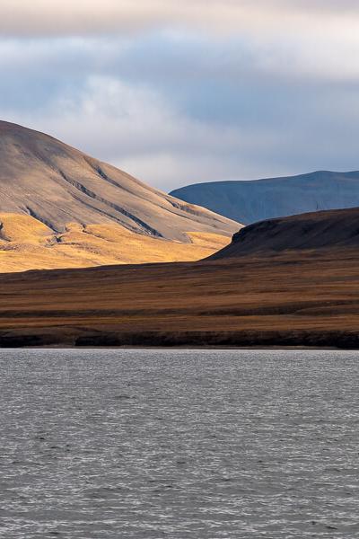 Svalbard Seaview Sunlit Valley Mosscovered Mountains Clouds900