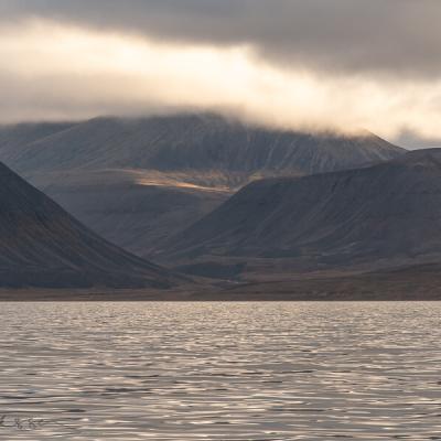 Svalbard Seaview Mountains Clouds Sunlit Spot Mountainside900 Svalbard Seaview Mountains Clouds Sunlit Spot Mountainside900