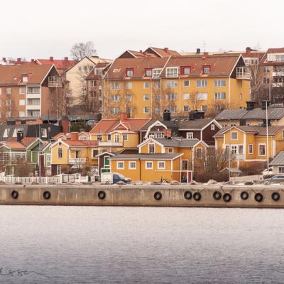 Yellow houses by the quay a grey day in Härnösand, Sweden Se Hrnsand Quay Houses Yellow Ocher Green