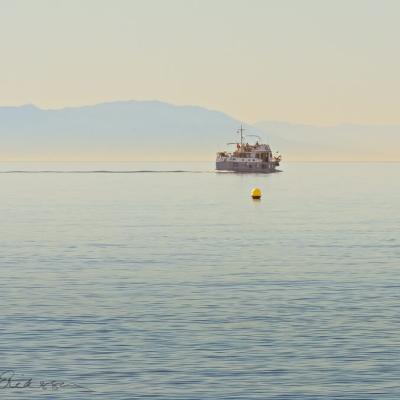 Spain Mediterranean Yellow Buoys Boat Haze Background Mountains900 Spain Mediterranean Yellow Buoys Boat Haze Background Mountains900