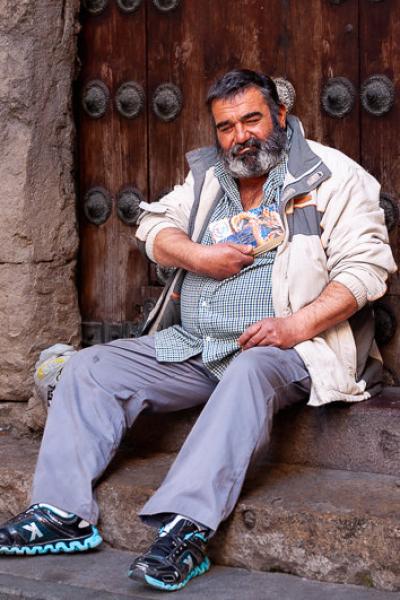 This man had made himself a hut in the huge gate of a medieval building, reading and drinking a little, in Cordoba, Spain 31mars17 Nikon 170218