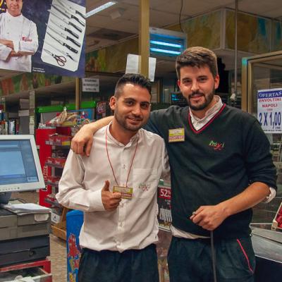 Two happy guys working at a supermarket in Rio de Janeiro, Brazil 31mars17 Nikon 232227