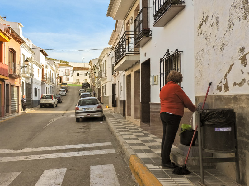 man and woman on each side of the street
